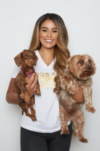 Woman holding Dachshund and Yorkie dogs
